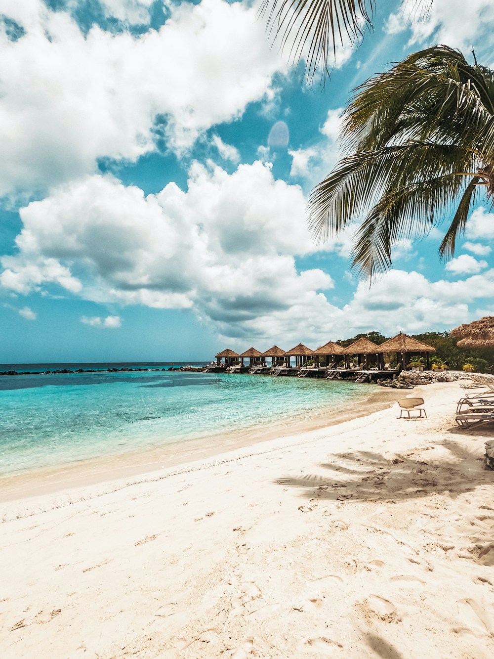 White sand, palms and turquoise water on an Aruba beach